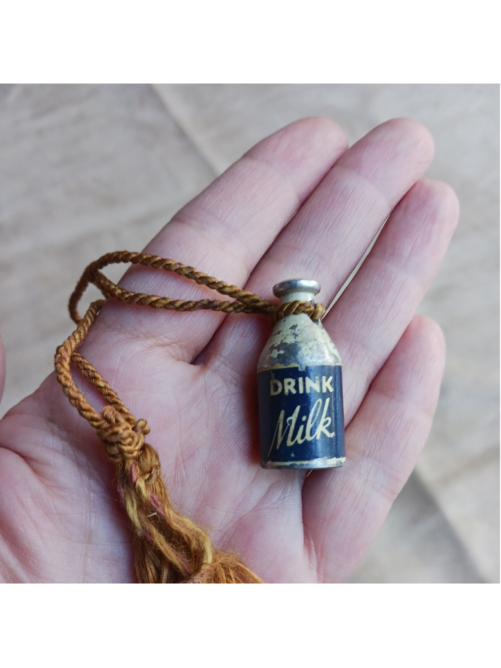 Vintage figural cast metal pencil sharpener milk bottle paper label Clark Mfg VA
